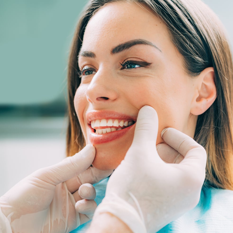 Dentist with beautiful female patient